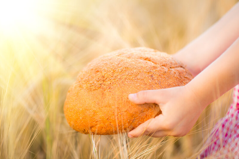 Child Holding Bread