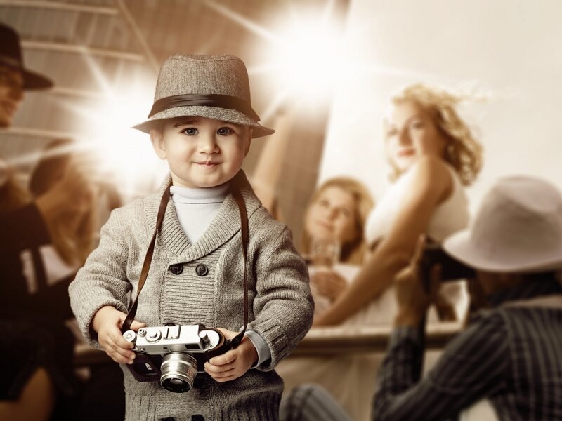 Child Holding Camera — Brown, Dramatic
