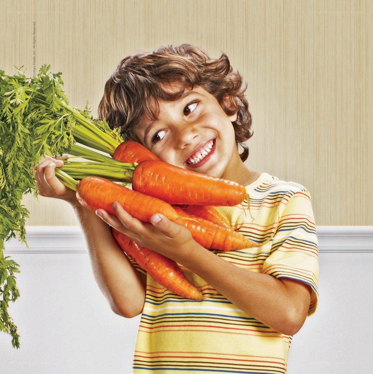 child holding carrots