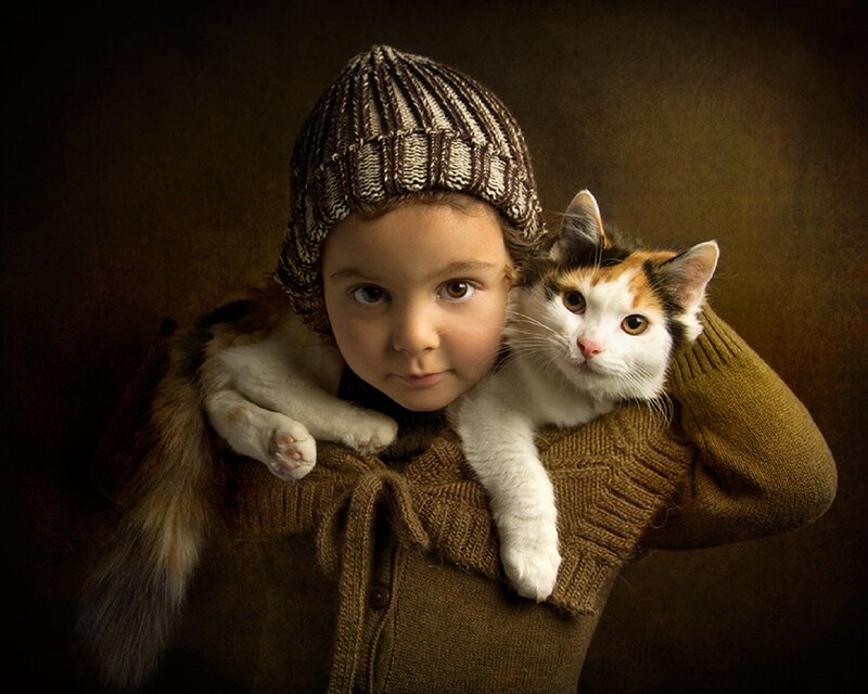 Child Holding Cat — Brown