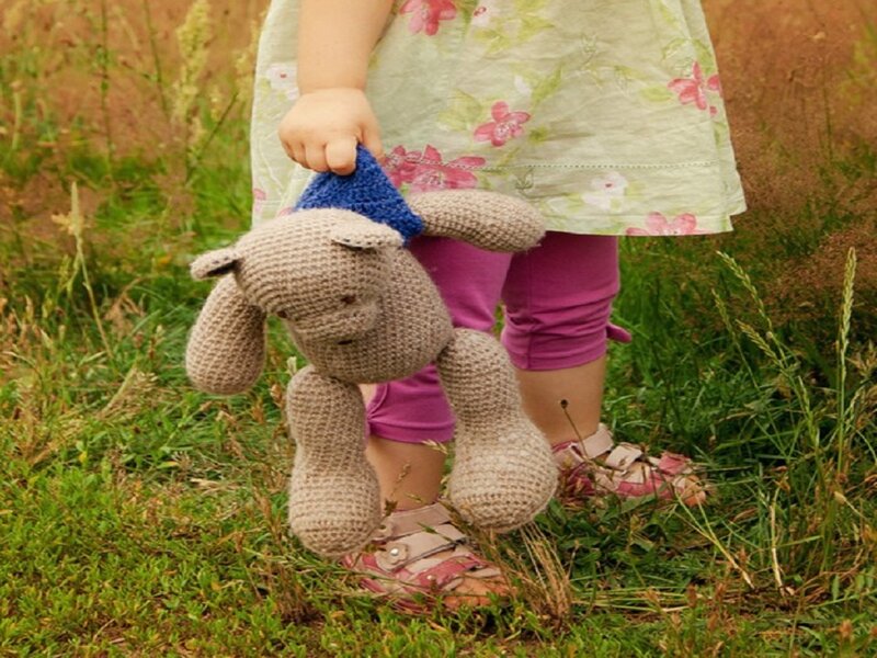 Child Holding Crocheted Bear
