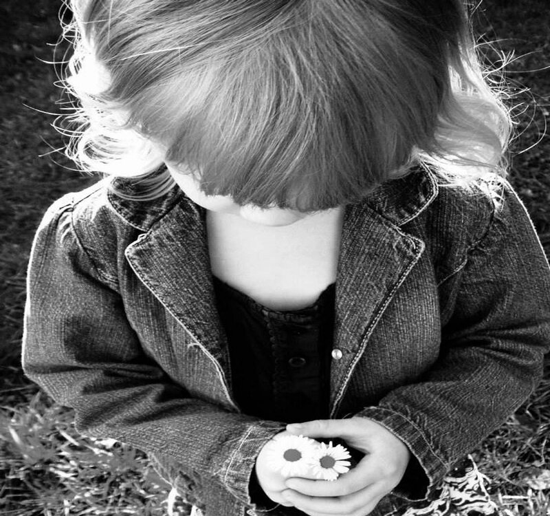 Child Holding Daisies — Black, Calm