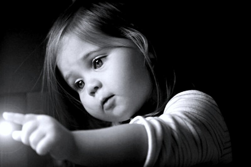 Child Holding Flashlight