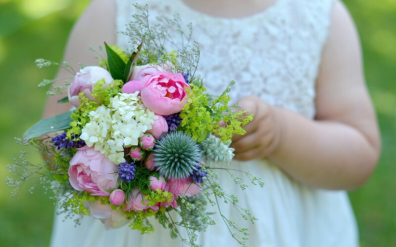 Child Holding Flower Bouquet