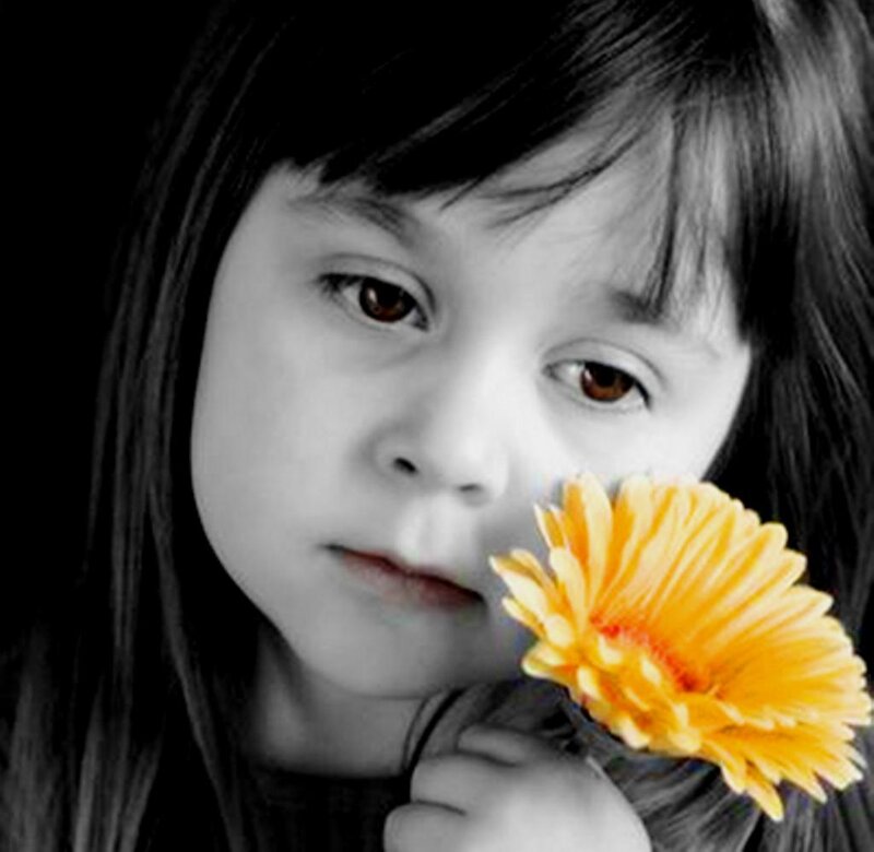 Child Holding Flower — Yellow