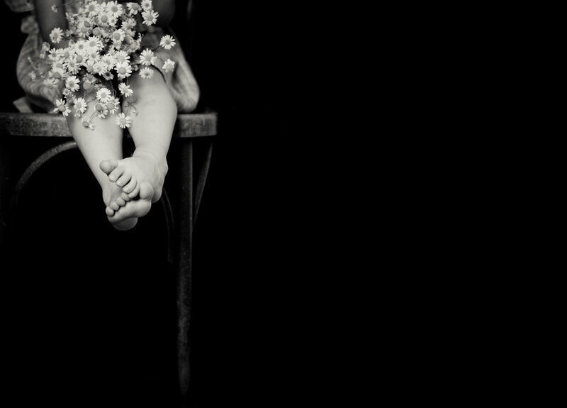 Child Holding Flowers — Black