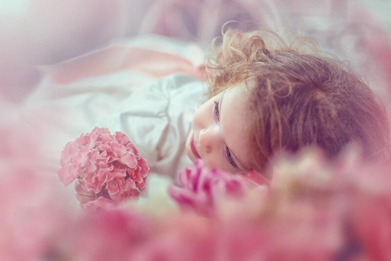 Child Holding Flowers — Pink