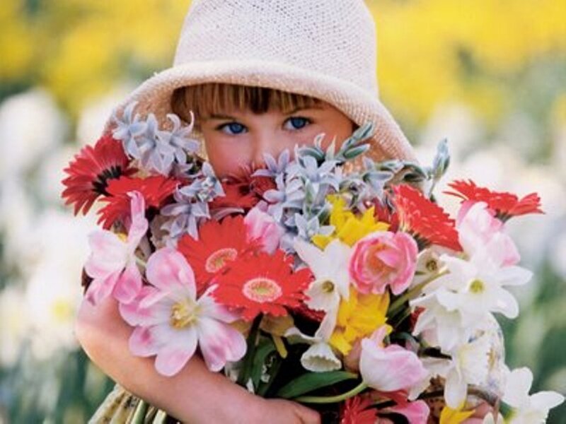 child holding flowers