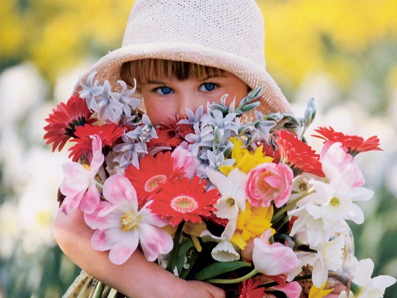 Child Holding Flowers — Yellow