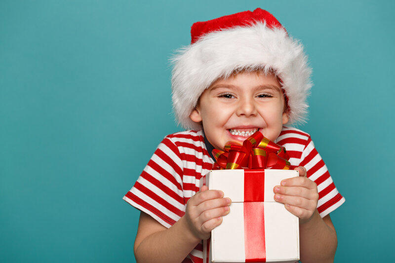 Child Holding Gift — Red
