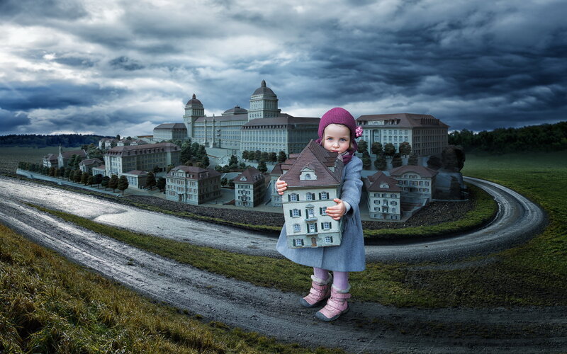 Child Holding House Model