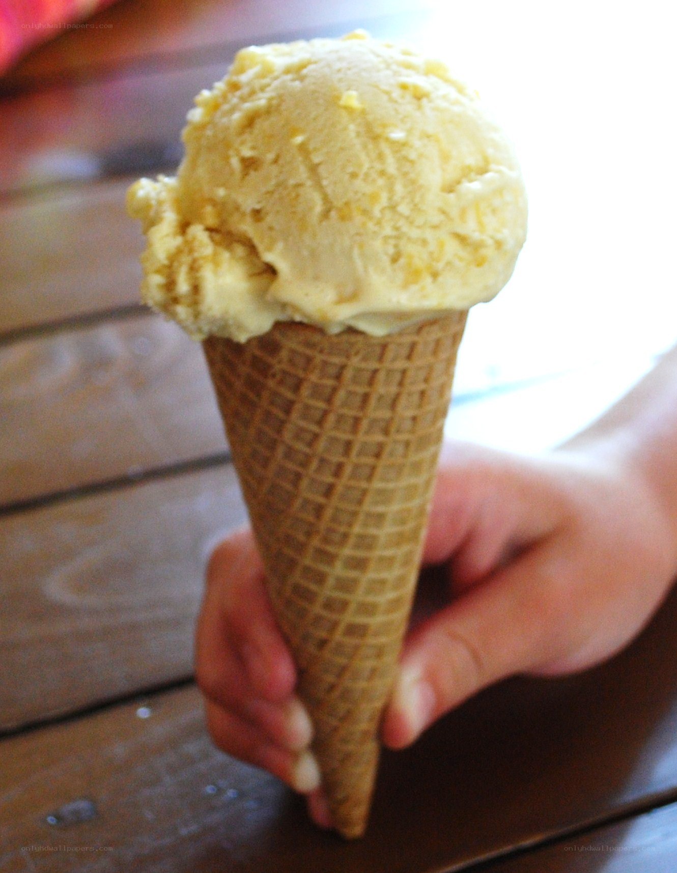 child holding ice cream cone