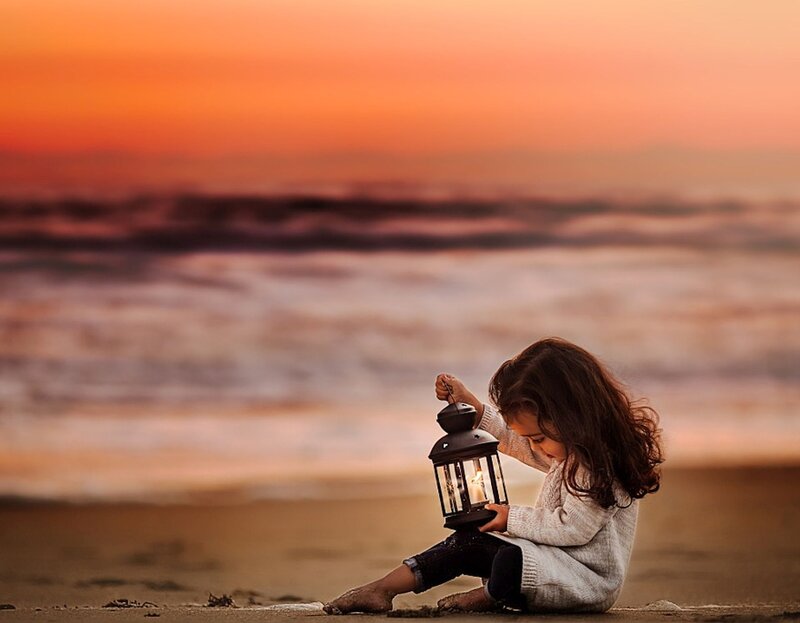 Child Holding Lantern — Orange