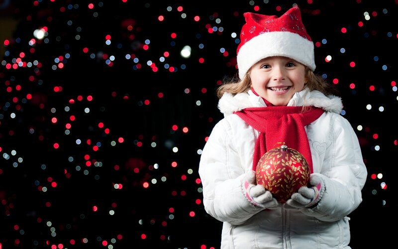 child holding ornament