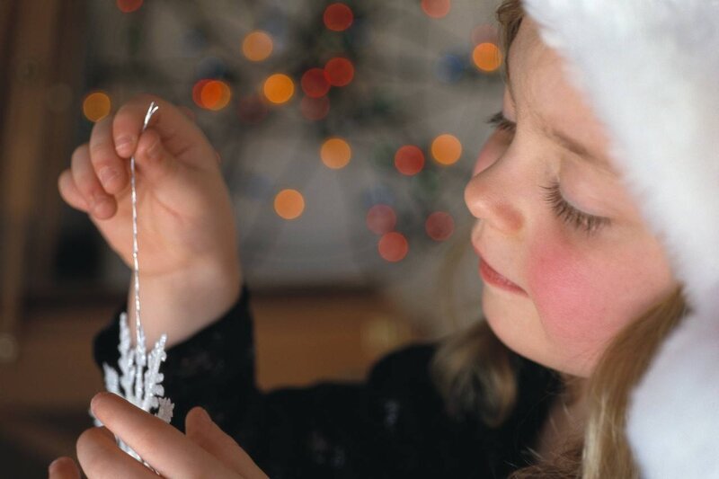 Child Holding Ornament — White