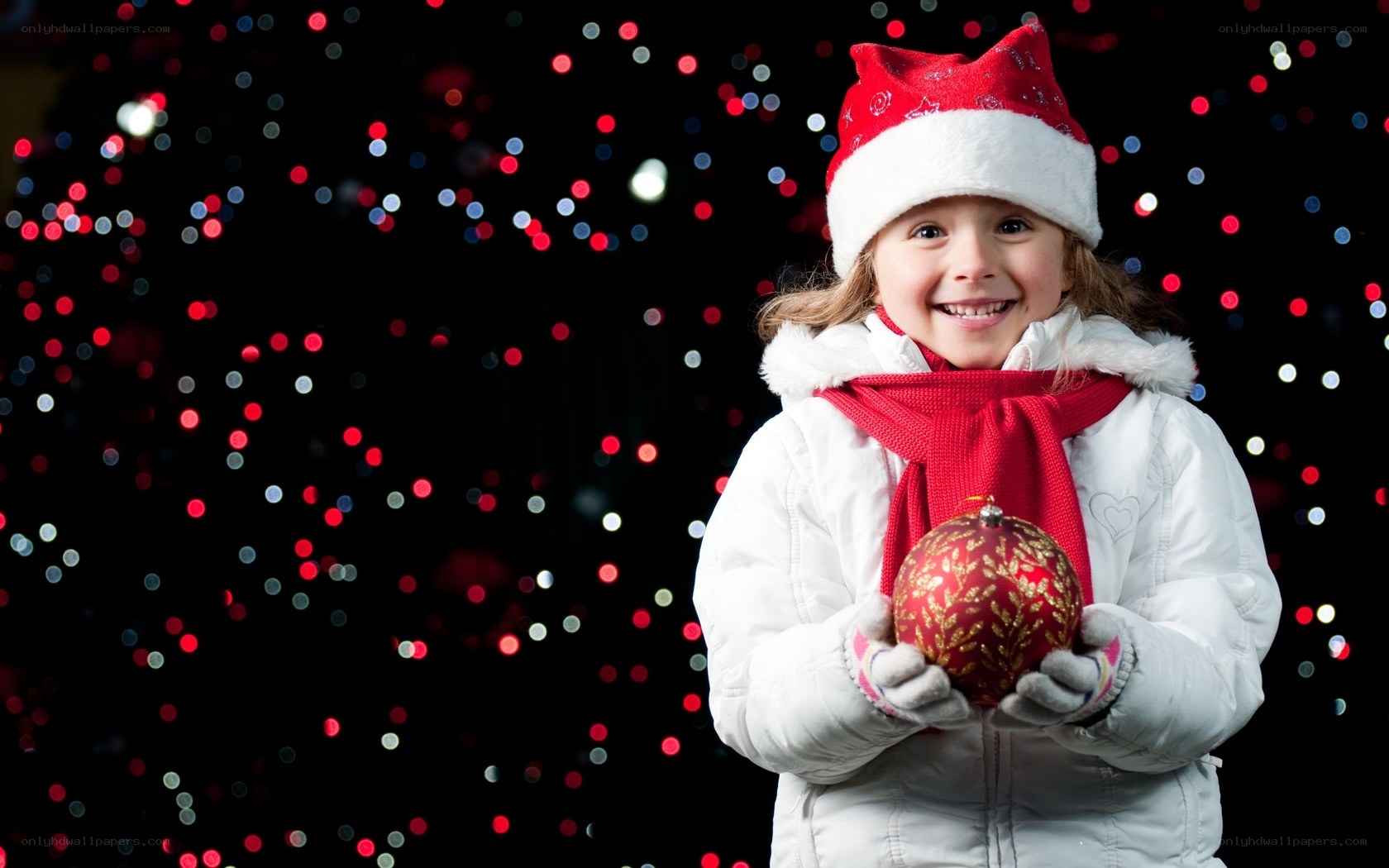 child holding ornament