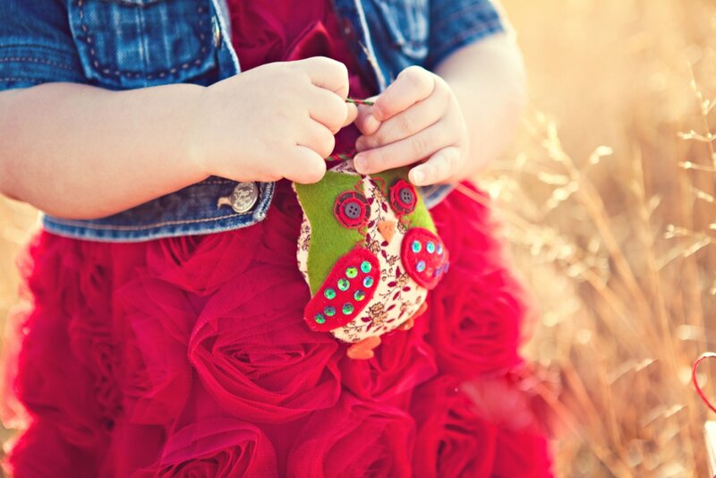 Child Holding Owl Ornament