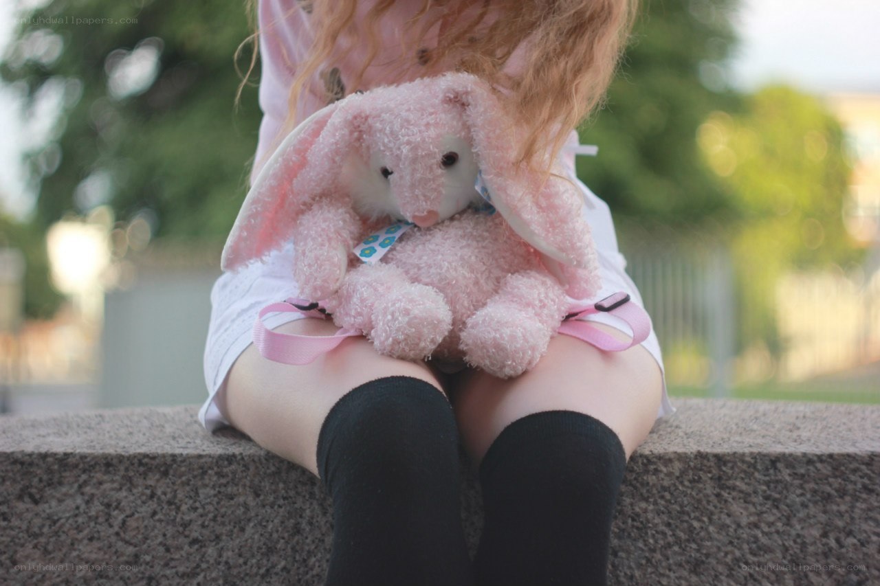child holding pink bunny