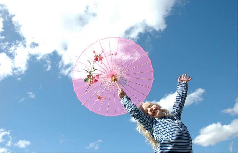 Child Holding Pink Parasol
