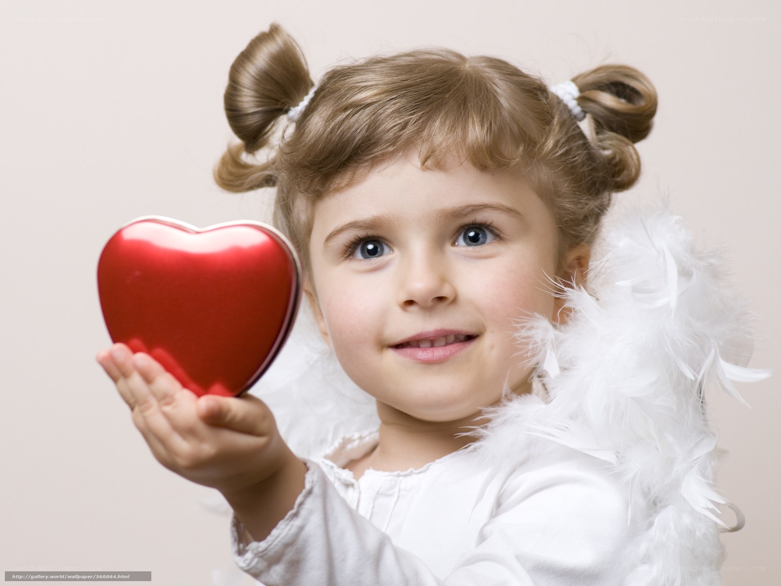child holding red heart