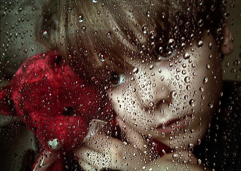 Child Holding Red Teddy Bear