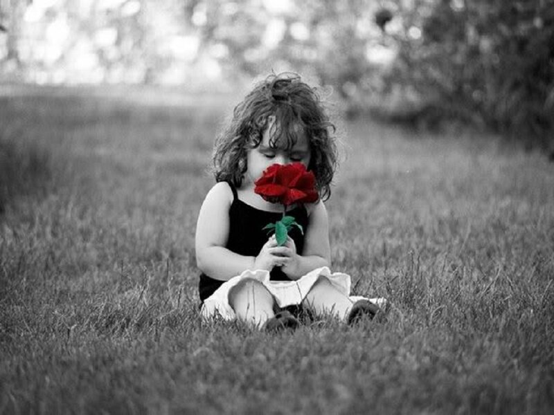 Child Holding Rose — Black