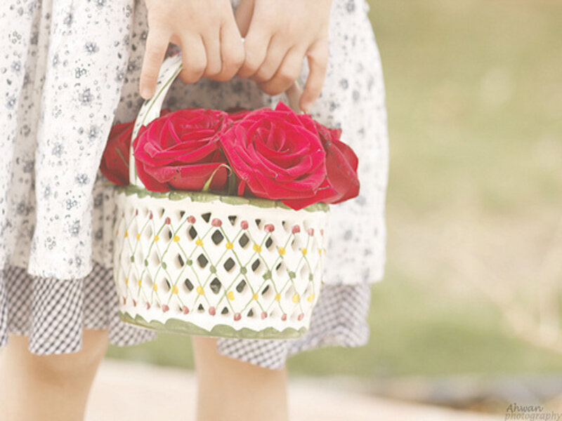 Child Holding Roses