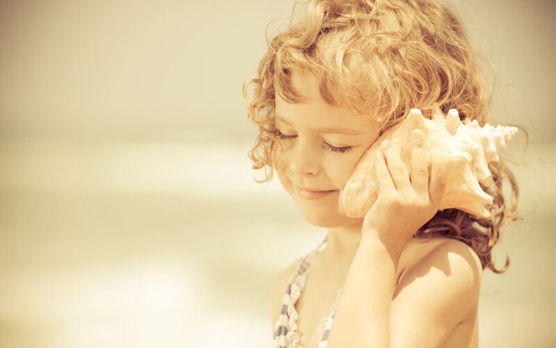 Child Holding Seashell