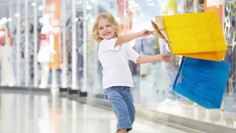 Child Holding Shopping Bags — Yellow