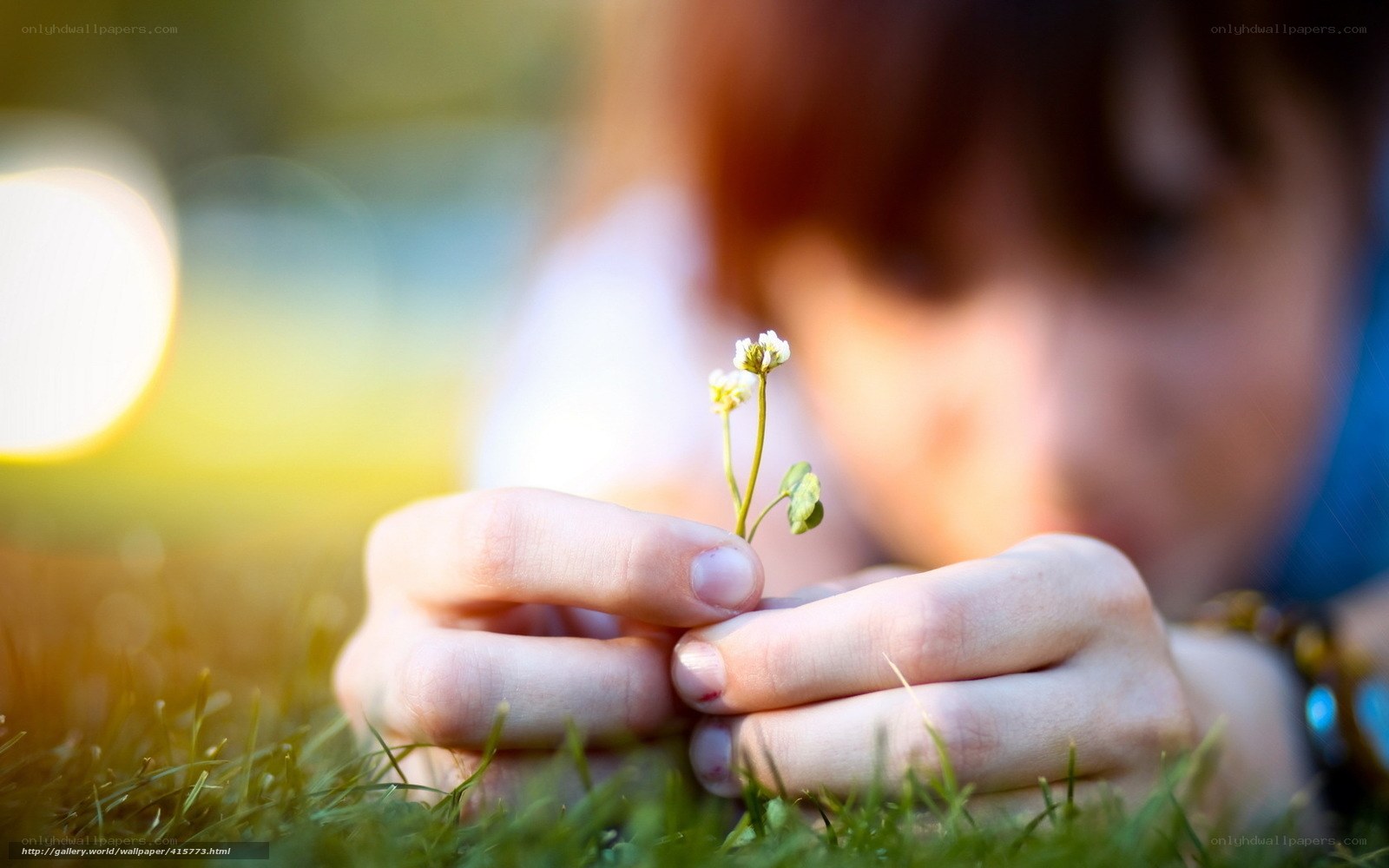 child holding small flower