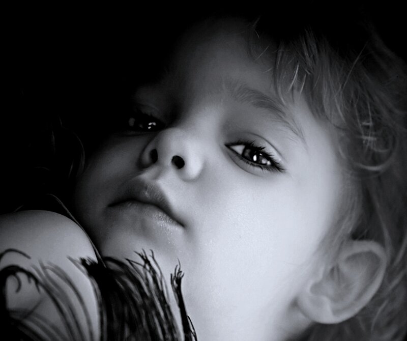 Child Holding Stuffed Animal