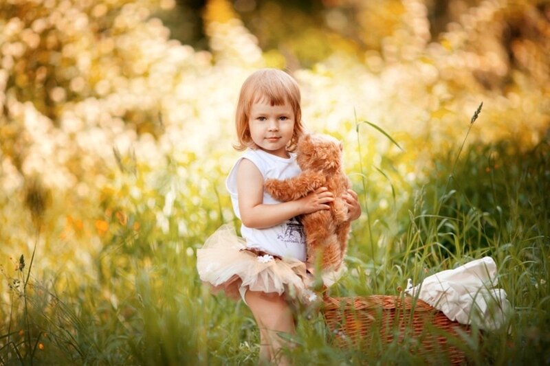 Child Holding Teddy Bear — Green, Serene