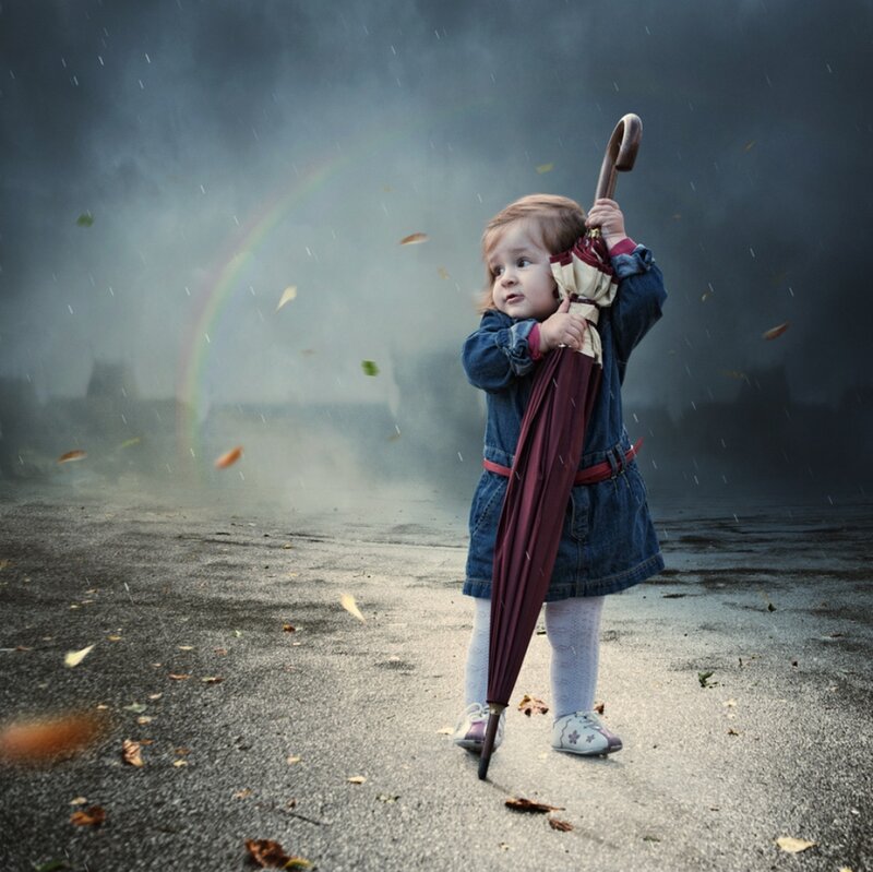 Child Holding Umbrella