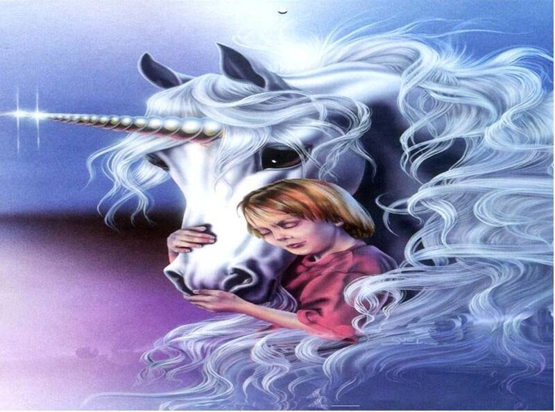 child hugging a unicorn
