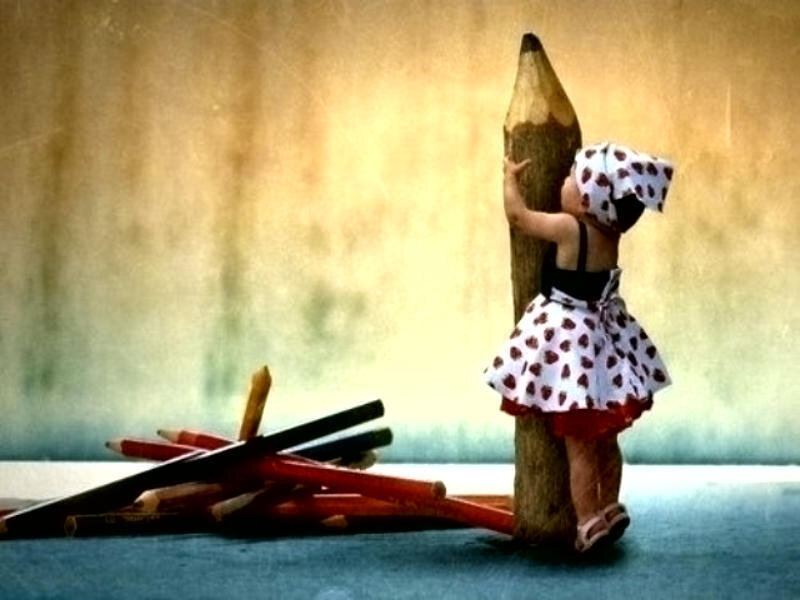 Child Hugging Giant Pencil