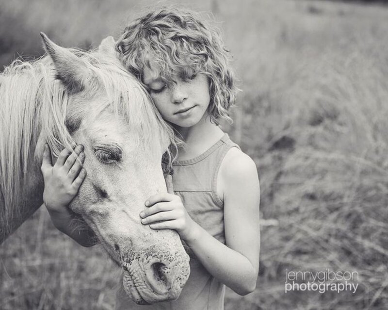 Child Hugging Horse — Black