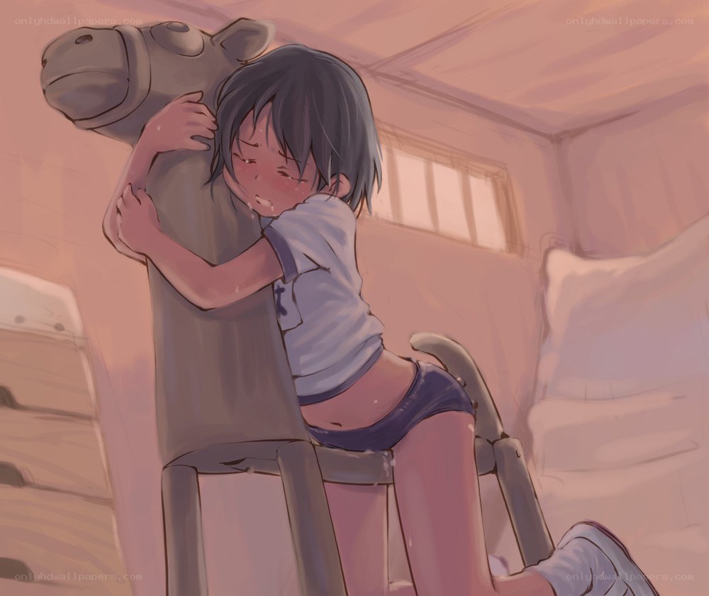 child hugging toy horse