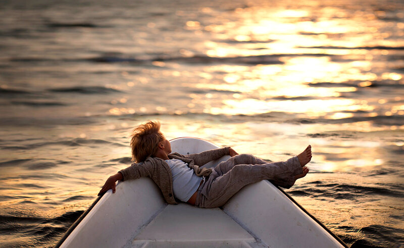 Child in a Boat — Gold