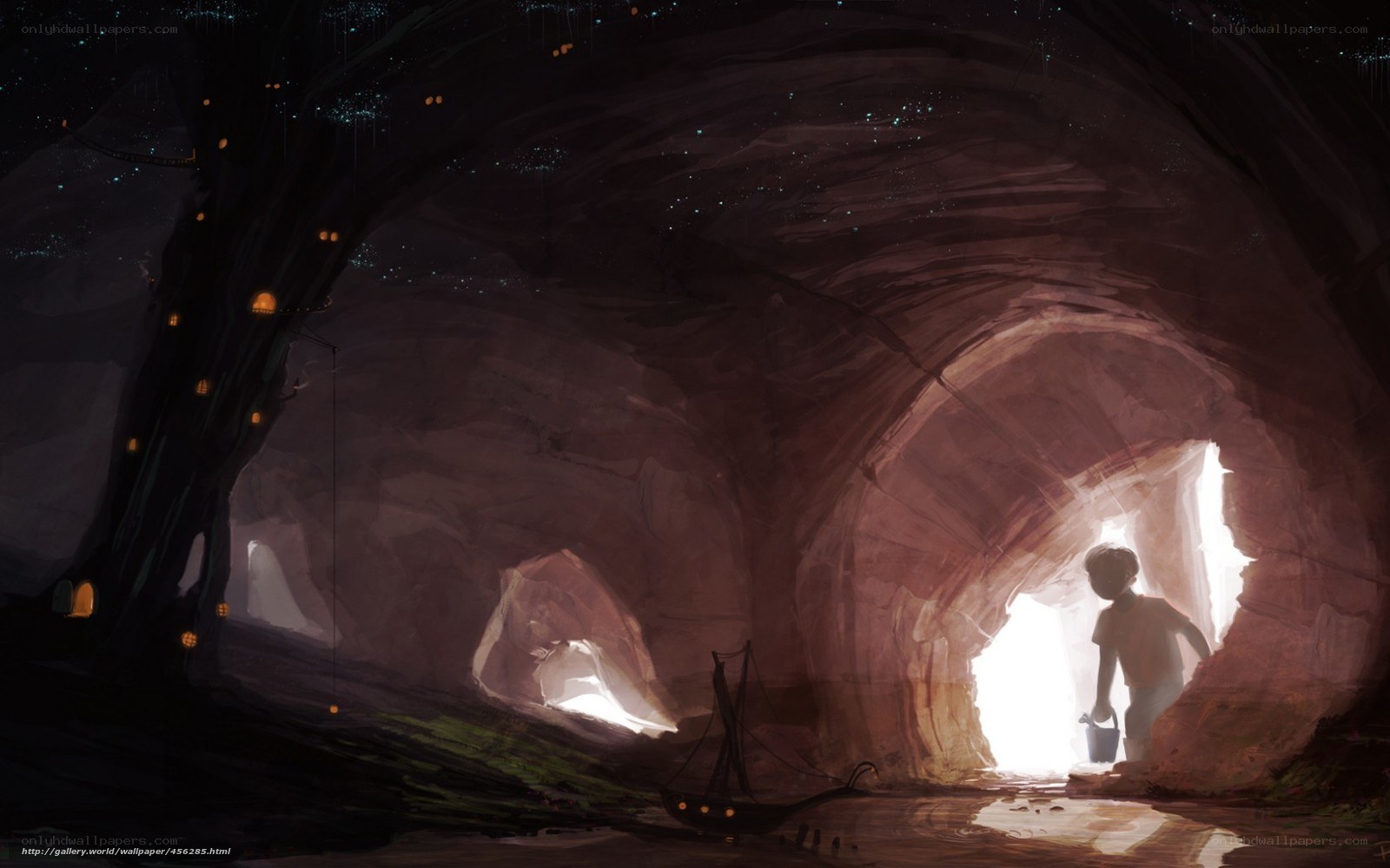 Child in a cave with lanterns