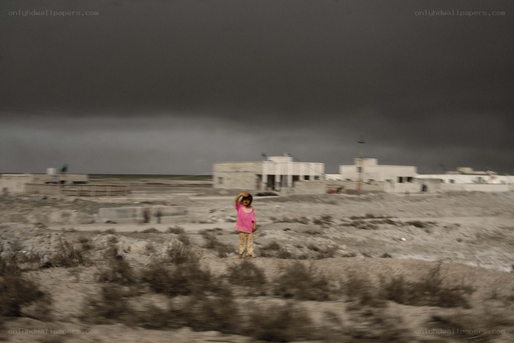 Child in a desert landscape