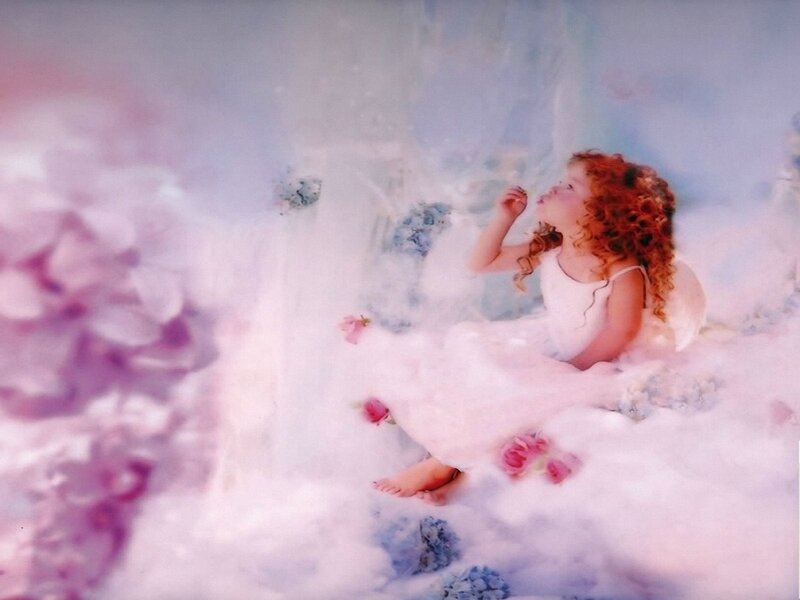 child in a dreamy floral scene