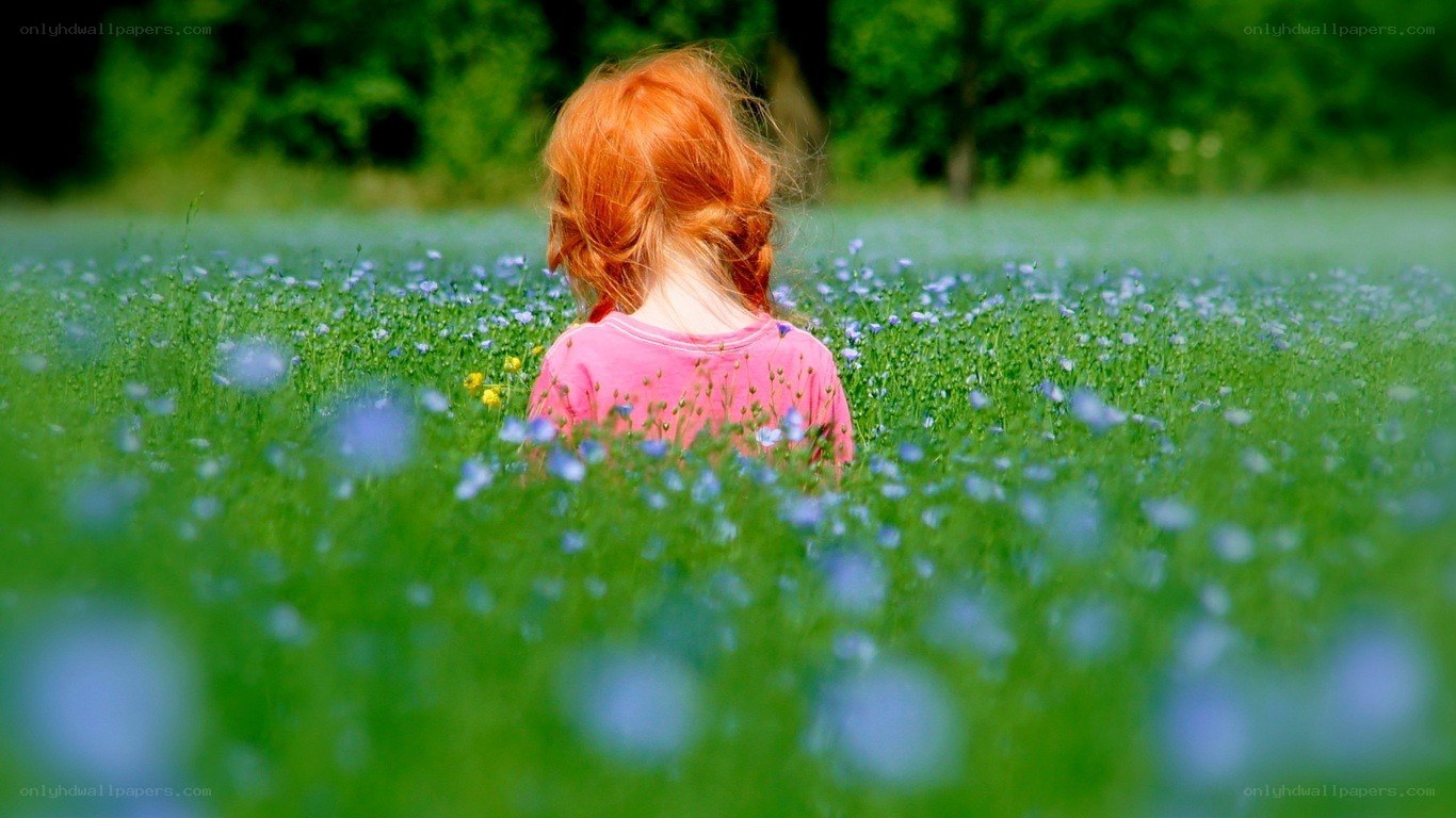 child in a flower field