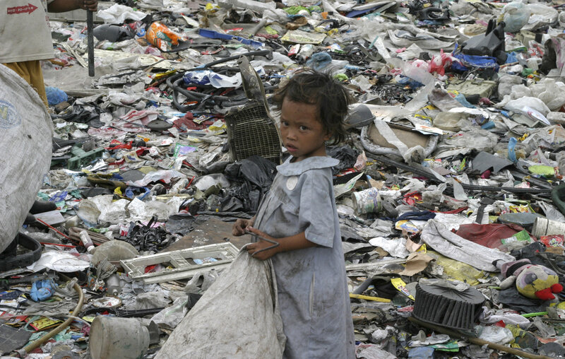 Child in a garbage dump