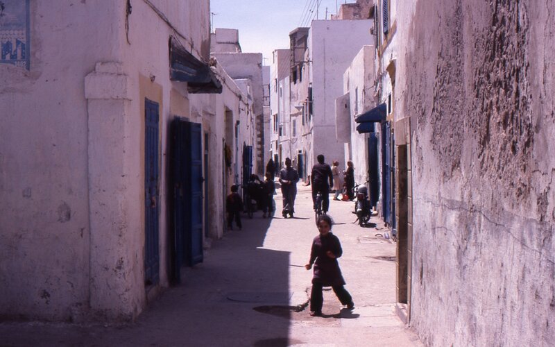 Child in a narrow alleyway