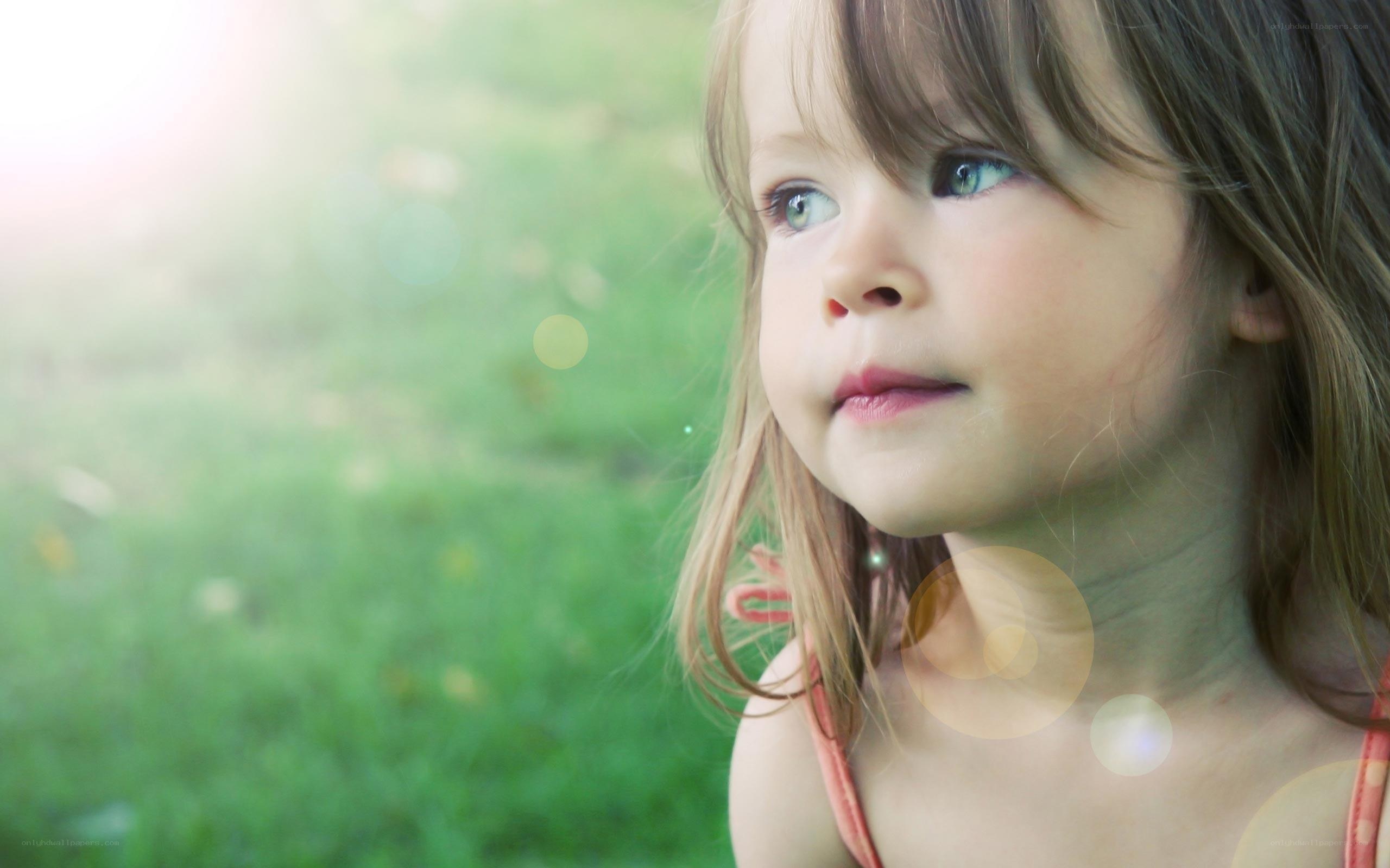 child in a sunlit field