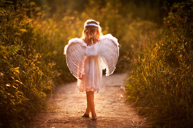 Child in Angel Costume — White, Serene, Sunset