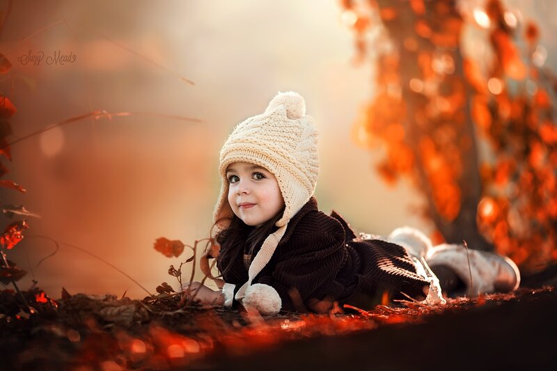 Child in Autumn Leaves — Orange, Serene, Photograph
