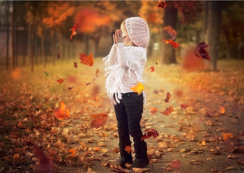 Child in Autumn Leaves — Orange, Serene