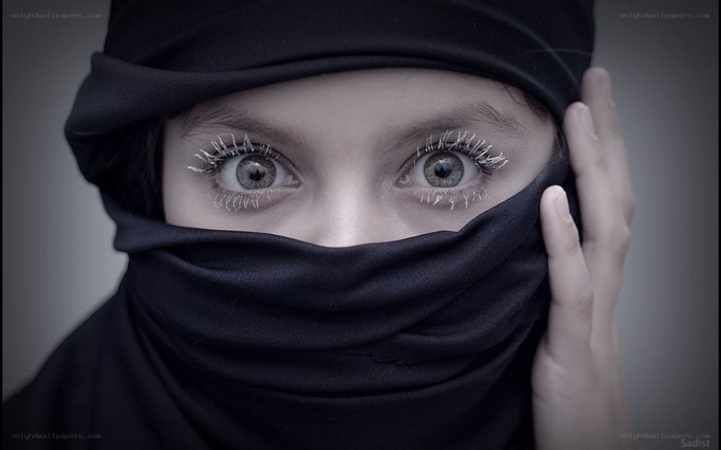 child in black headscarf