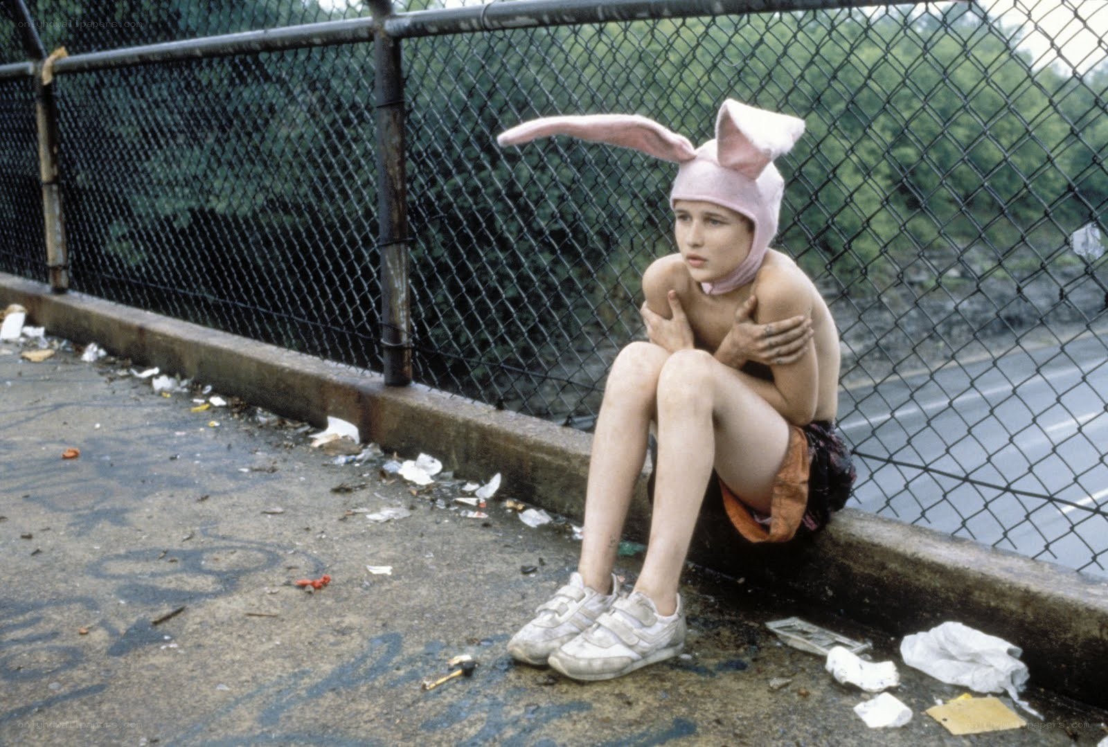 Child in bunny hat on bridge